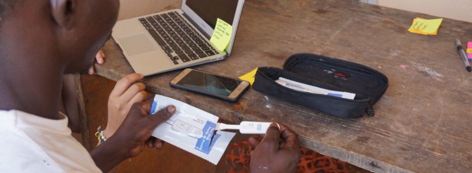 A man uses a HIV self testing kit